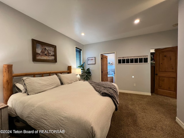 bedroom with dark colored carpet