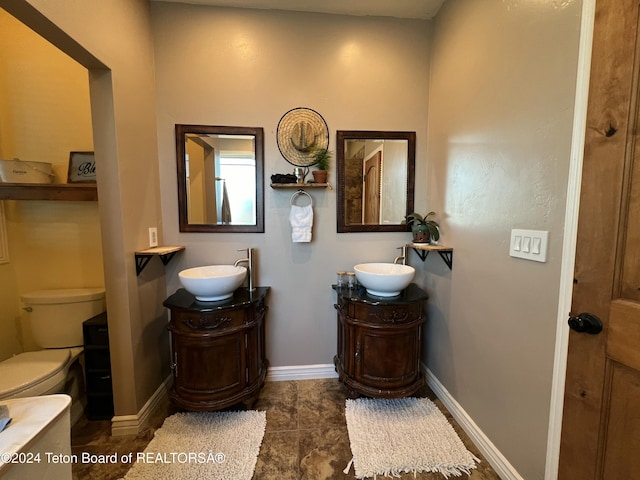 8 S Kicking Bird Rd, Pinedale, WY 82941 - full bathroom with two vanities and baseboards