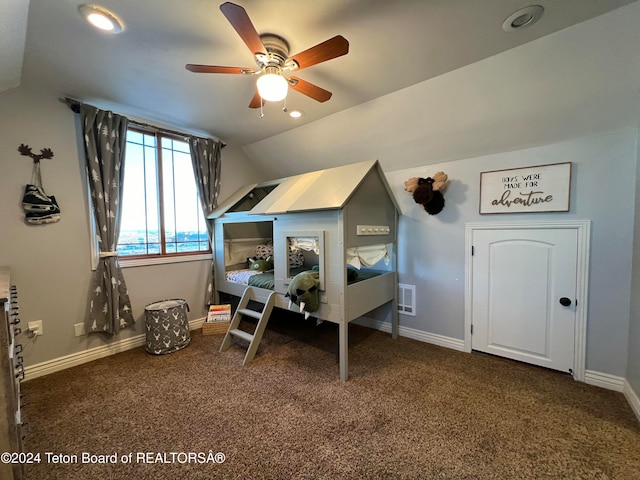 carpeted bedroom featuring vaulted ceiling and ceiling fan