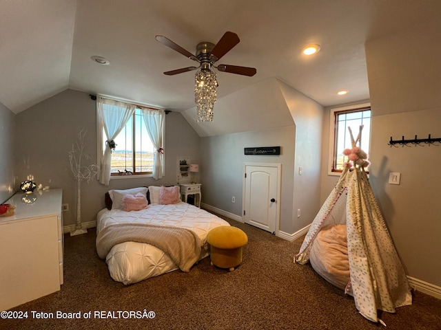 carpeted bedroom featuring ceiling fan, multiple windows, and vaulted ceiling