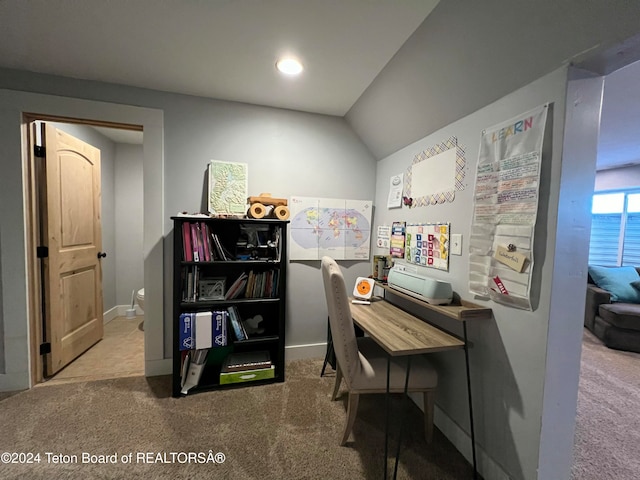 office space featuring carpet and vaulted ceiling