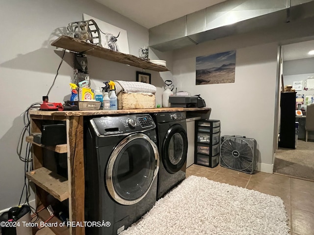 laundry room featuring light tile patterned floors and washer and dryer