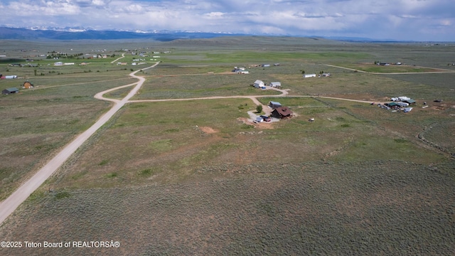 8 S Kicking Bird Rd, Pinedale, WY 82941 - aerial view of property and surrounding area featuring rural landscape and a mountainous background