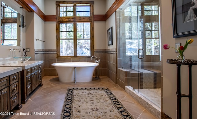 bathroom featuring vanity, tile patterned flooring, separate shower and tub, and tile walls