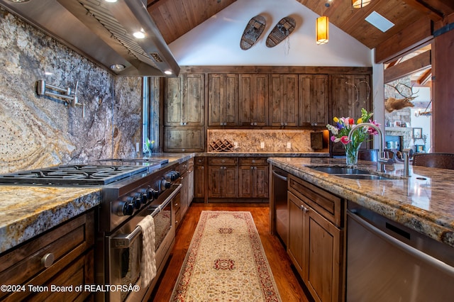 kitchen with stainless steel appliances, sink, wall chimney exhaust hood, hardwood / wood-style floors, and wood ceiling