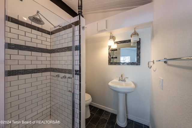 bathroom with toilet, an enclosed shower, and tile patterned floors