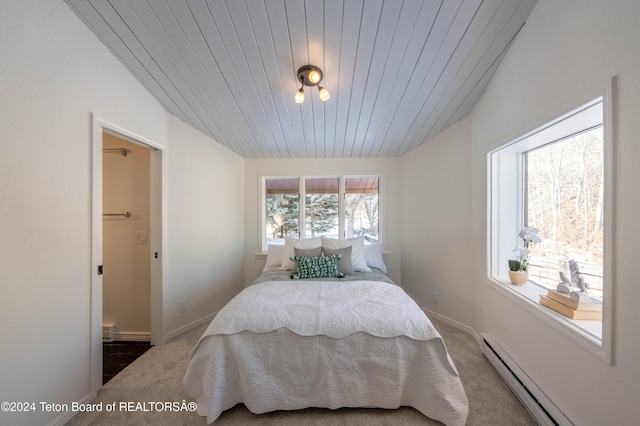 bedroom with carpet, a baseboard radiator, wood ceiling, and vaulted ceiling