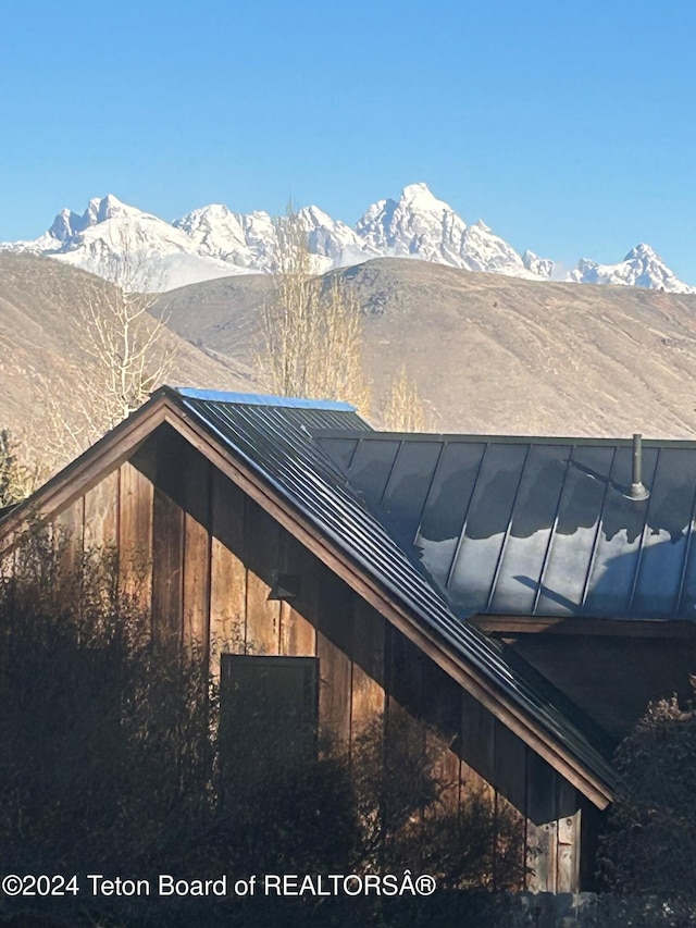 view of property exterior featuring a mountain view