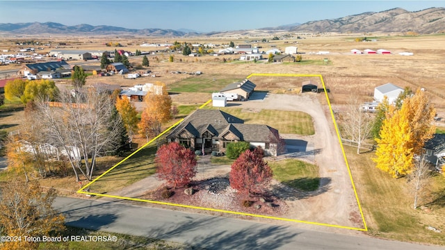 birds eye view of property with a mountain view