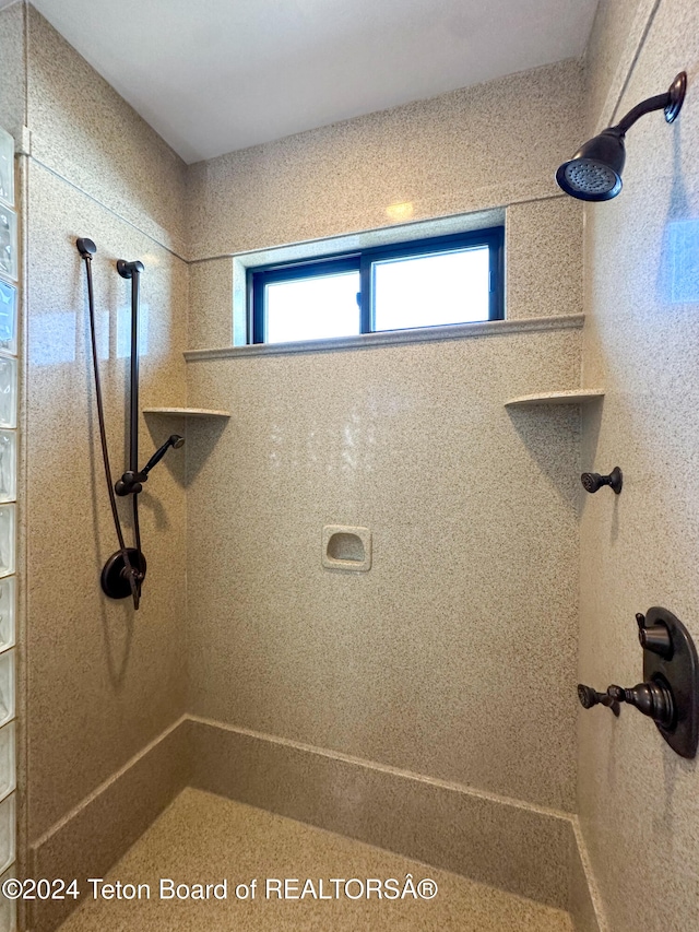 bathroom with tiled shower