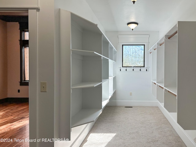 walk in closet featuring light hardwood / wood-style floors