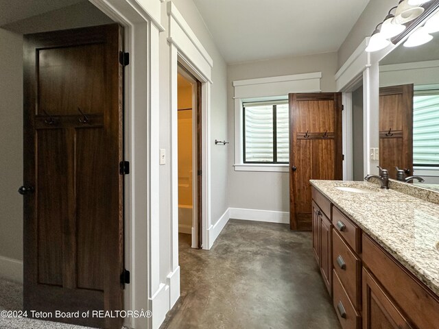 bathroom featuring vanity and concrete floors