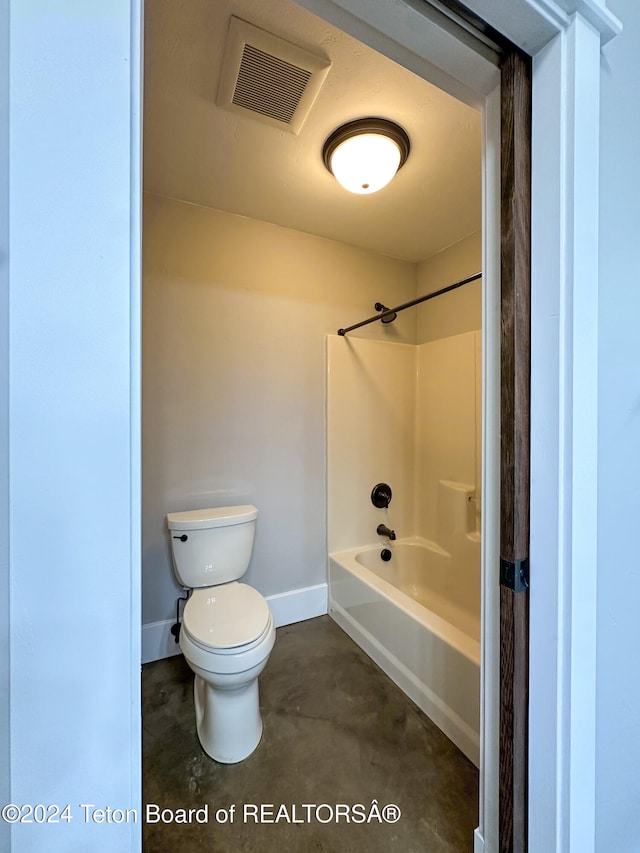 bathroom featuring shower / tub combination, concrete floors, and toilet