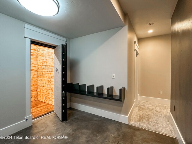 corridor with concrete flooring