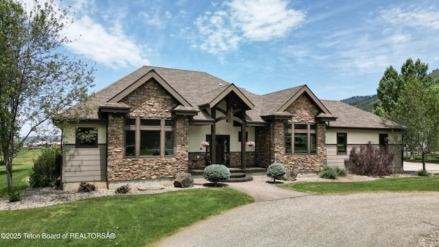81 Twin Cliffs Rd, Afton, WY 83110 - craftsman-style home with stone siding and a front yard