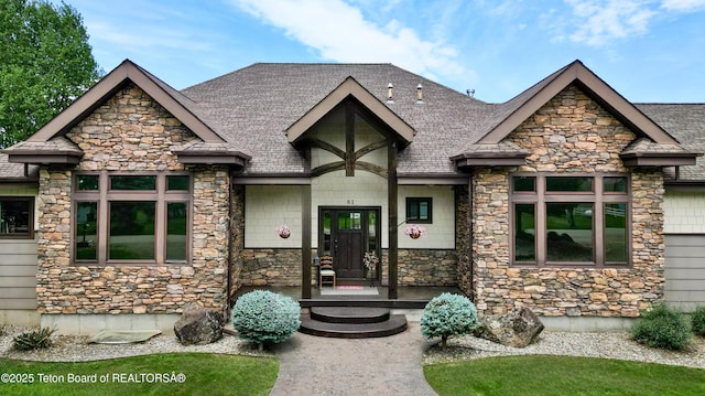 81 Twin Cliffs Rd, Afton, WY 83110 - view of front of house featuring stone siding and roof with shingles
