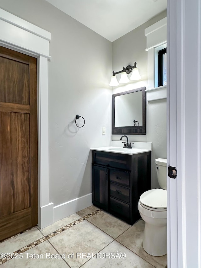 81 Twin Cliffs Rd, Afton, WY 83110 - bathroom with vanity, tile patterned flooring, and inlaid floor details