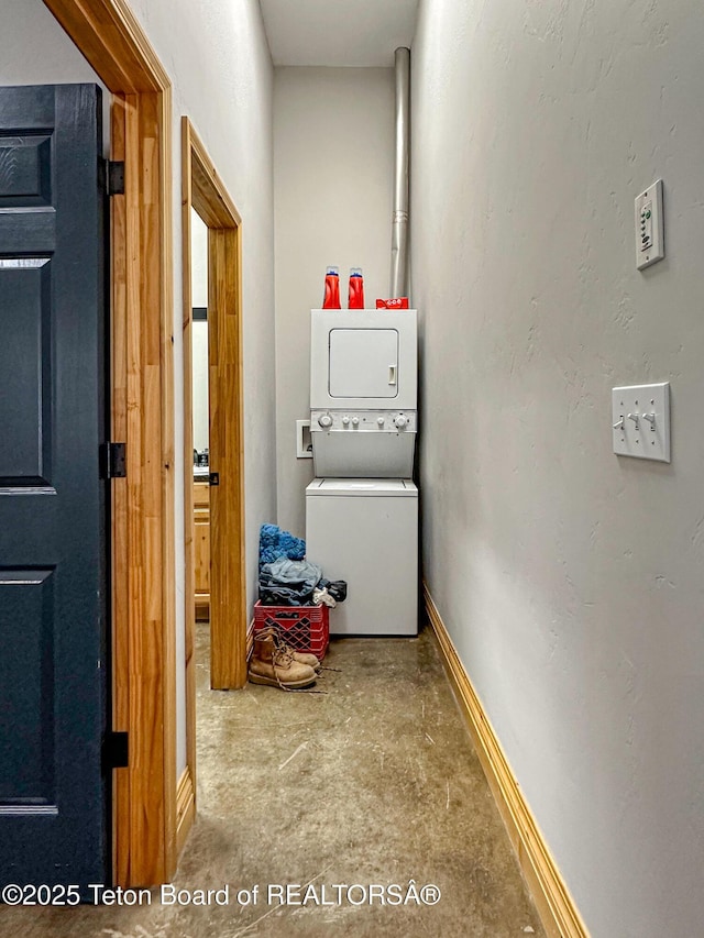 81 Twin Cliffs Rd, Afton, WY 83110 - laundry area featuring stacked washer and clothes dryer and baseboards