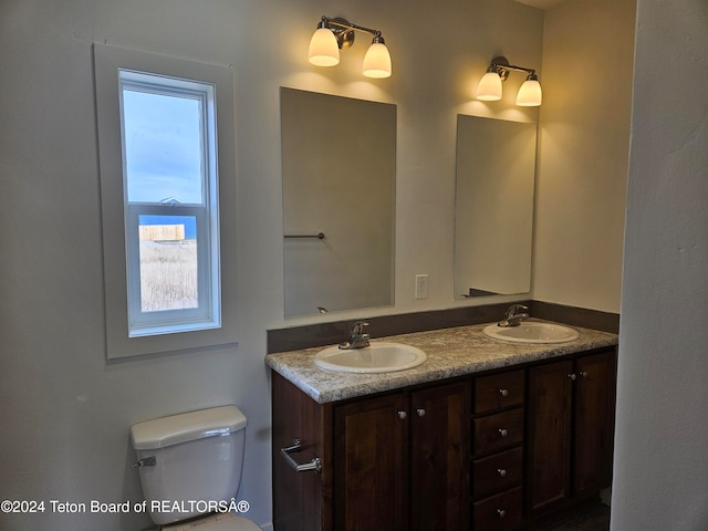 bathroom with vanity and toilet