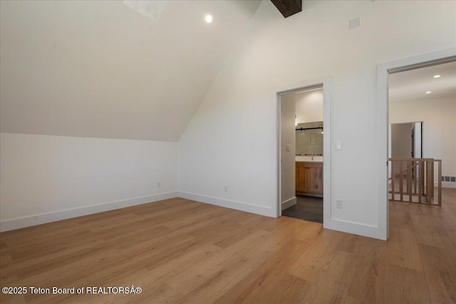 9071 Old Jackson Hwy, Victor, ID 83455 - bonus room featuring light wood finished floors, baseboards, lofted ceiling, and recessed lighting