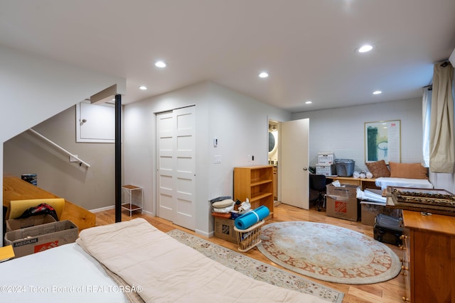 bedroom featuring a closet and light hardwood / wood-style floors