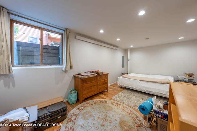 bedroom with light hardwood / wood-style floors