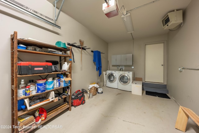 garage with a garage door opener and washing machine and clothes dryer