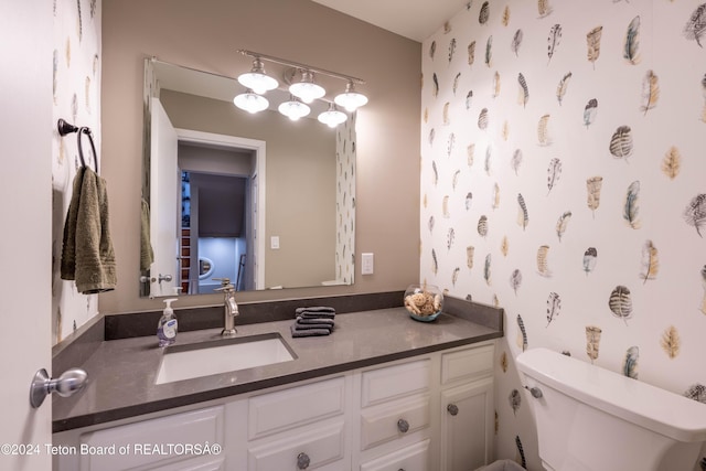 bathroom with vanity and toilet