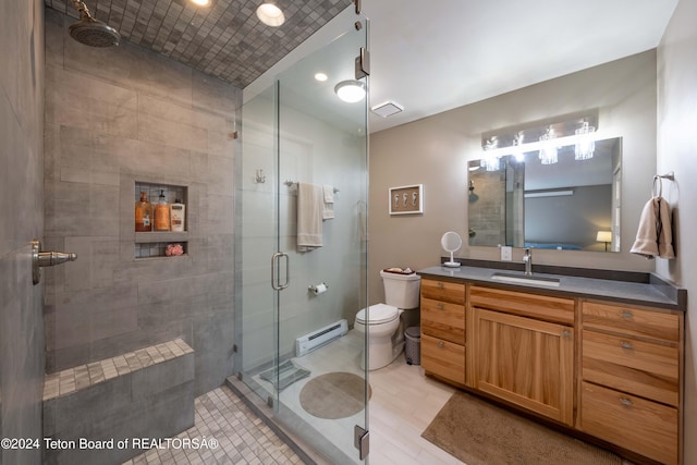 bathroom with a baseboard radiator, hardwood / wood-style floors, toilet, vanity, and a shower with shower door