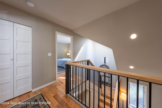 hall with light hardwood / wood-style floors