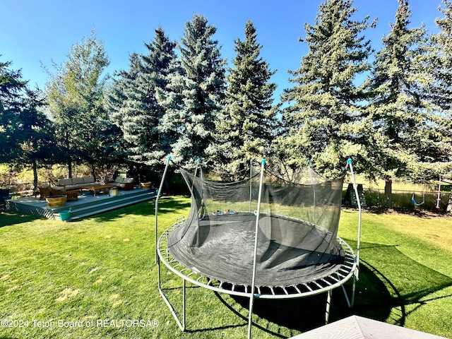 view of yard featuring a trampoline