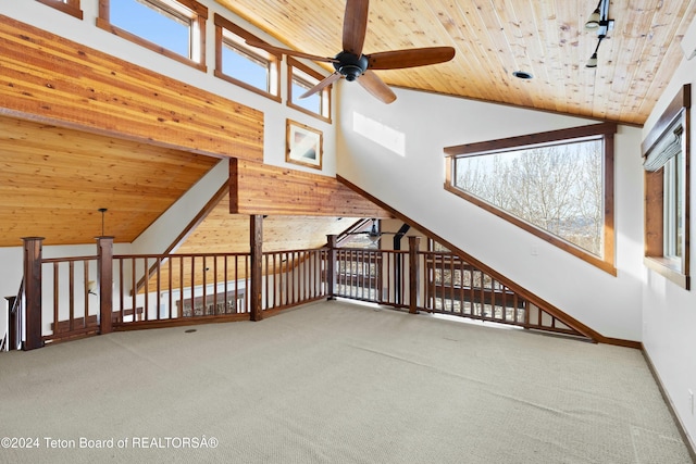 additional living space featuring carpet, ceiling fan, high vaulted ceiling, and wood ceiling