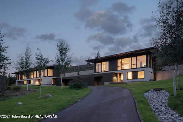 contemporary house with a front yard