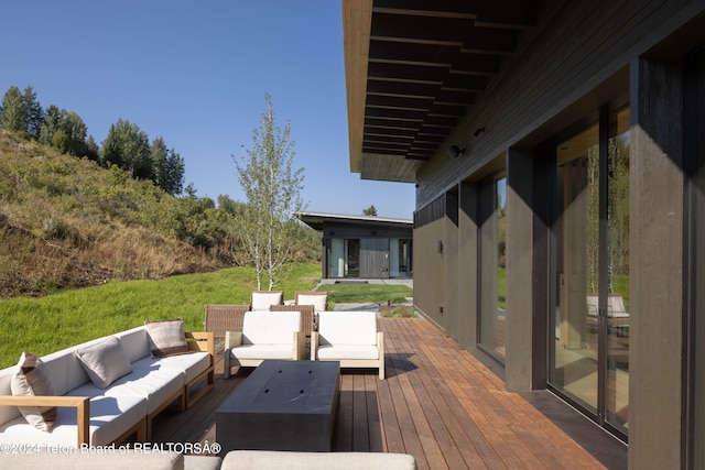 deck with an outdoor hangout area