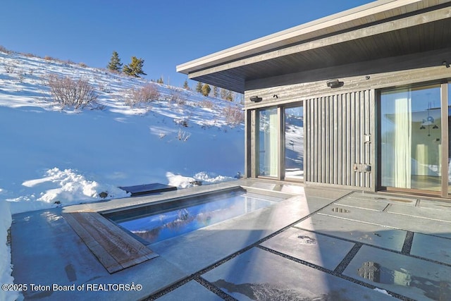 view of snow covered patio