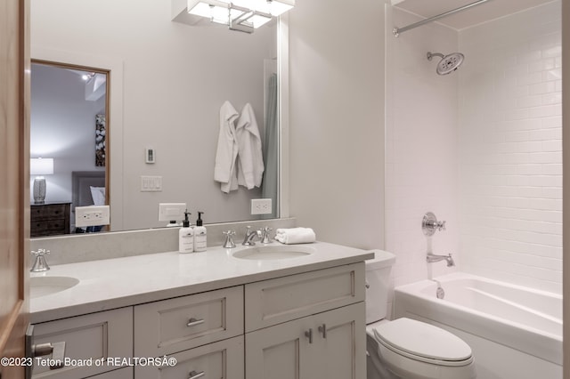 full bathroom with vanity, toilet, and tiled shower / bath