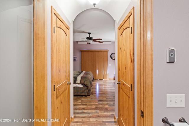 hall with wood-type flooring