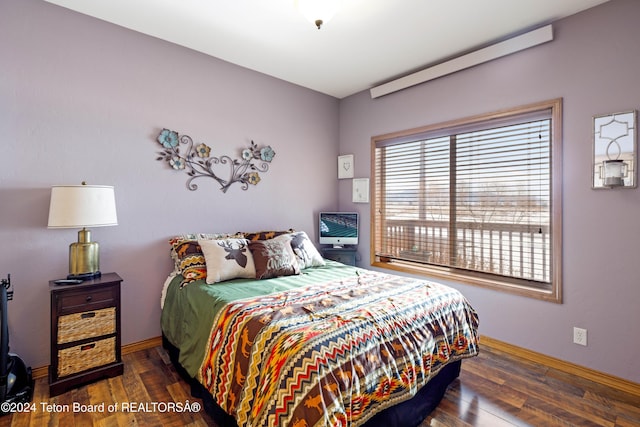 bedroom featuring dark hardwood / wood-style flooring