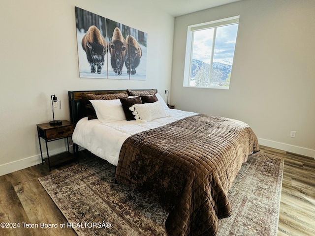 bedroom with hardwood / wood-style flooring