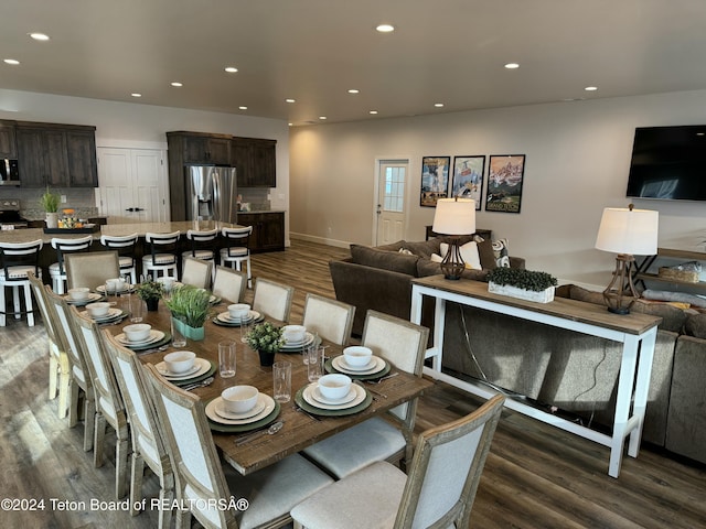 dining space featuring dark hardwood / wood-style flooring