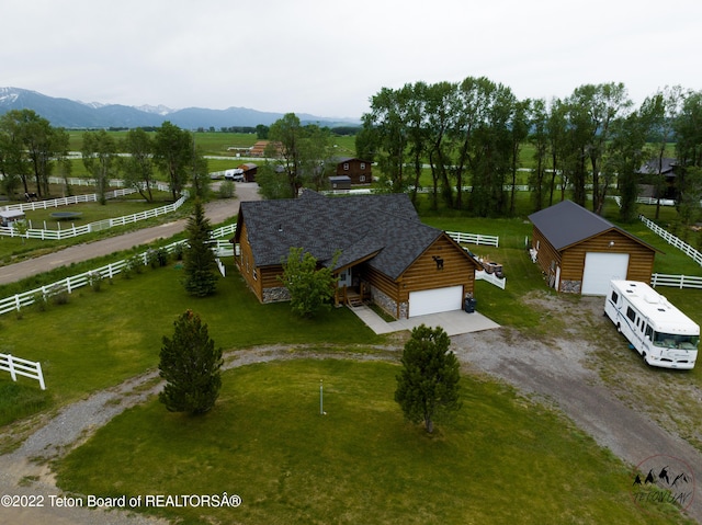 birds eye view of property featuring a mountain view and a rural view