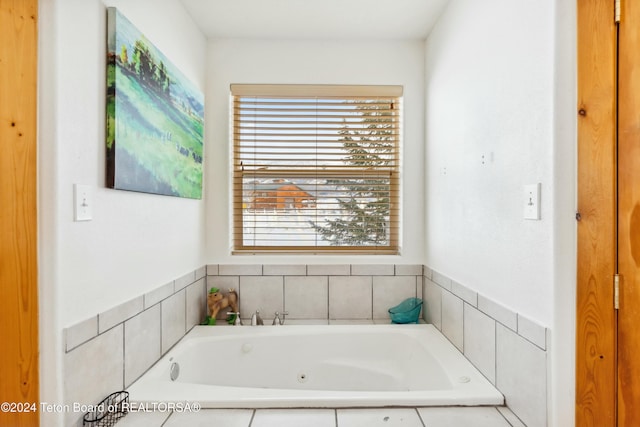 bathroom featuring a relaxing tiled tub