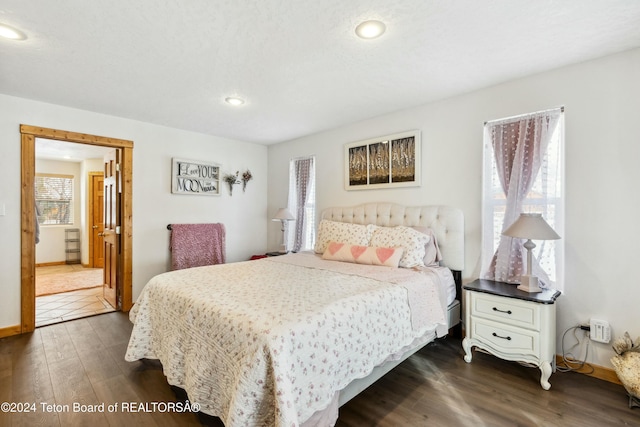 bedroom featuring dark wood-type flooring