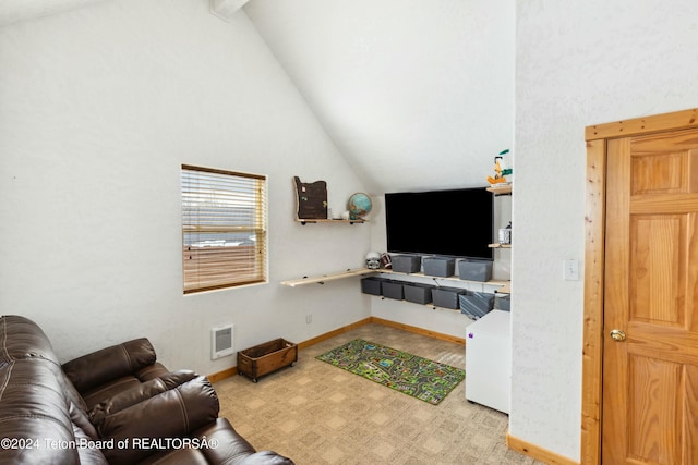 living room featuring light carpet and vaulted ceiling