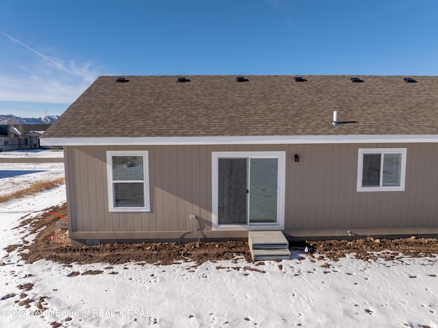 view of snow covered house