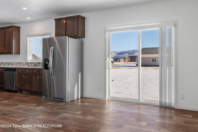 3829 Spruce Rd, Driggs, ID 83422 - kitchen with appliances with stainless steel finishes, crown molding, dark brown cabinetry, dark wood-style floors, and recessed lighting