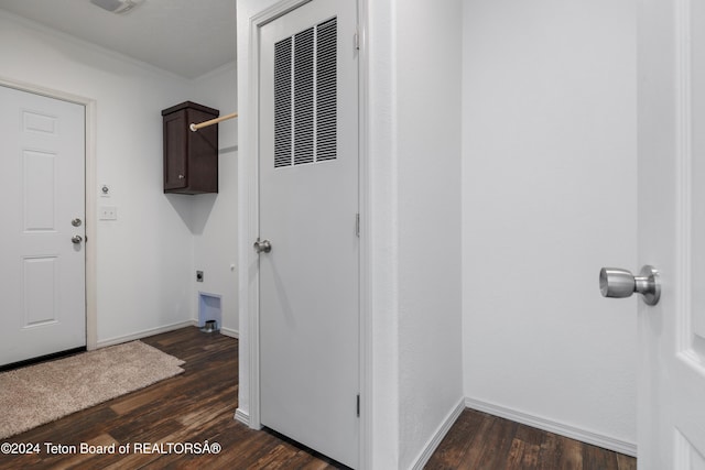 laundry room with cabinets, electric dryer hookup, dark hardwood / wood-style flooring, and ornamental molding