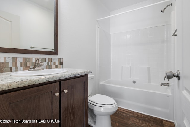 3829 Spruce Rd, Driggs, ID 83422 - bathroom with vanity, wood finished floors, bathing tub / shower combination, crown molding, and decorative backsplash