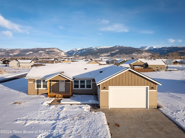 ranch-style house featuring a mountain view and a garage