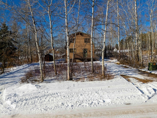 view of yard covered in snow